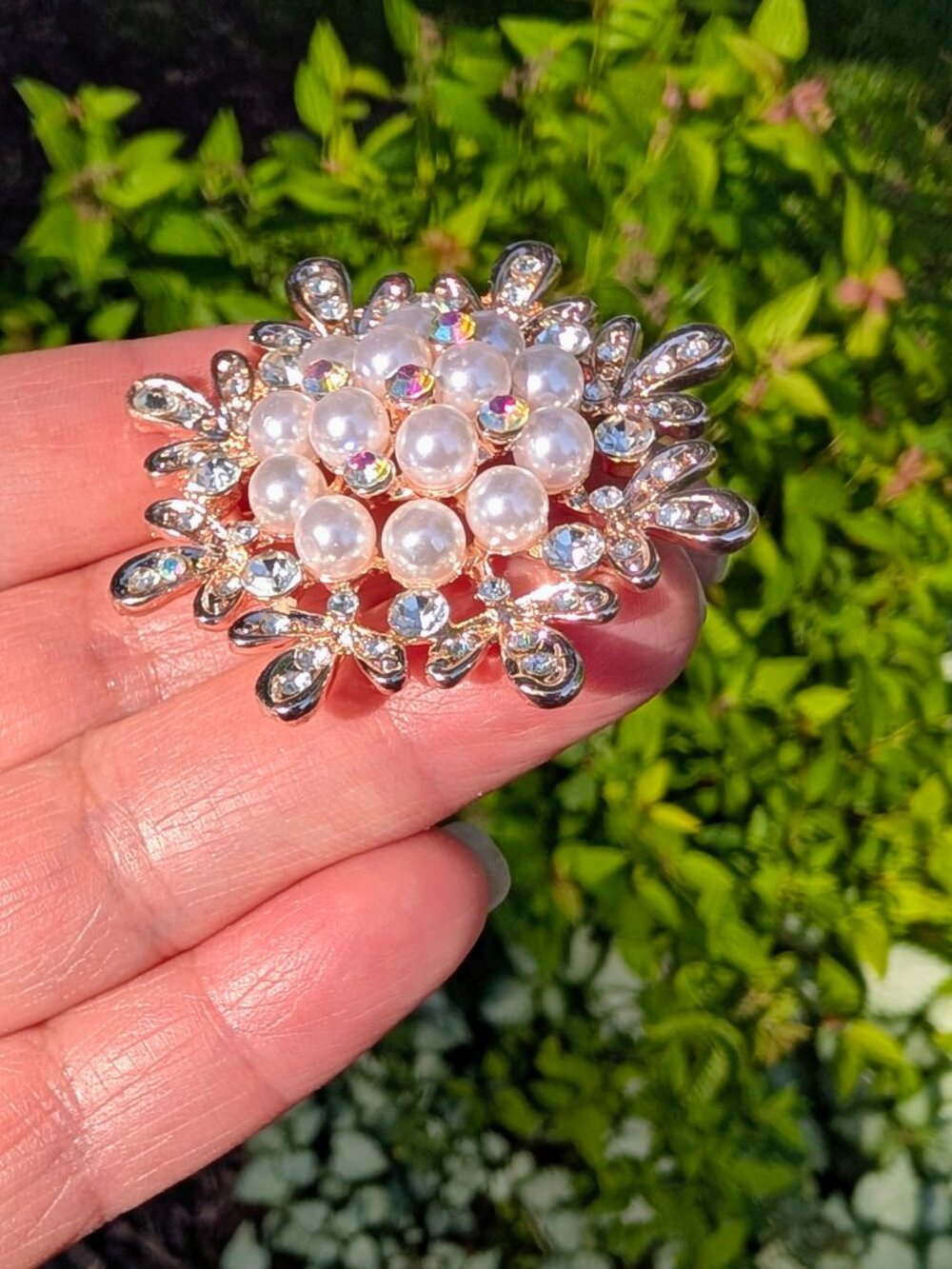 A Rose Gold -Tone Brooch in a Snowflake Design